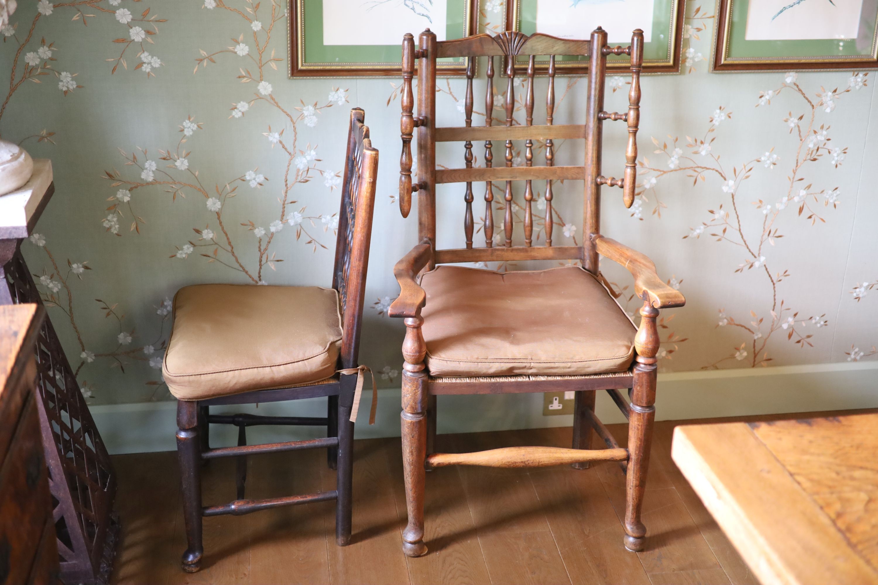 A harlequin set of twelve 19th century Derbyshire spindle back dining chairs, including two carvers, with rush seats and pad feet, height 93cm largest carver 115cm